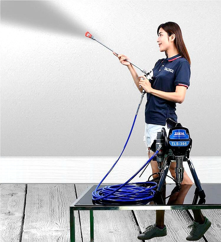 Woman using a airless sprayer